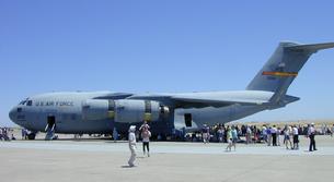 C-17 Globemaster III has a maximum weight of 585,000 pounds and is smaller than the C-5 Galaxy and is capable of landing on short airstrips