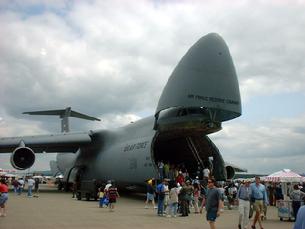 C-5 Galaxy with the doors open and landing gear lowered in the kneeling position