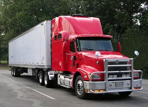 Tractor and trailer with trailer side boxes and DIRECTV antenna on the roof