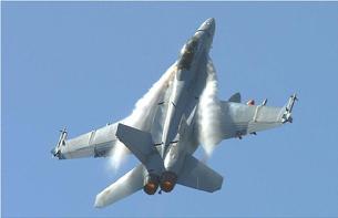 FA-18F Hornet doing a high-G pull-up. The high angle of attack causes powerful vortices to form at the leading edge extensions.