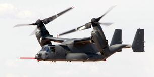 V-22 Osprey moving its engines. It can fly like an airplane with engines forward or hover like a helicopter with its engines pointing upward